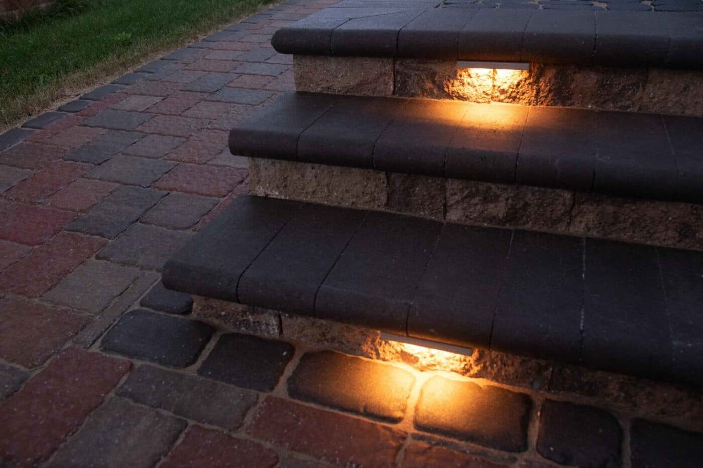Lighting under stone steps with stone walkway