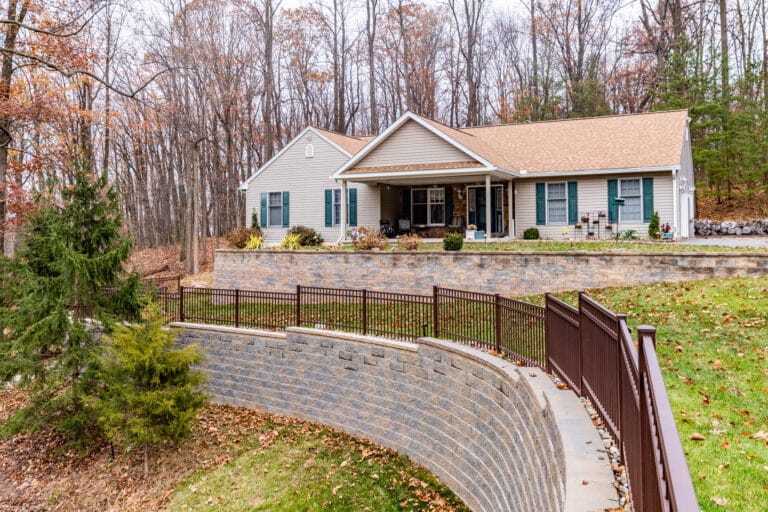 Image of a customers home and new retaining wall in Robeson Township by Willow Gates Home & Landscape