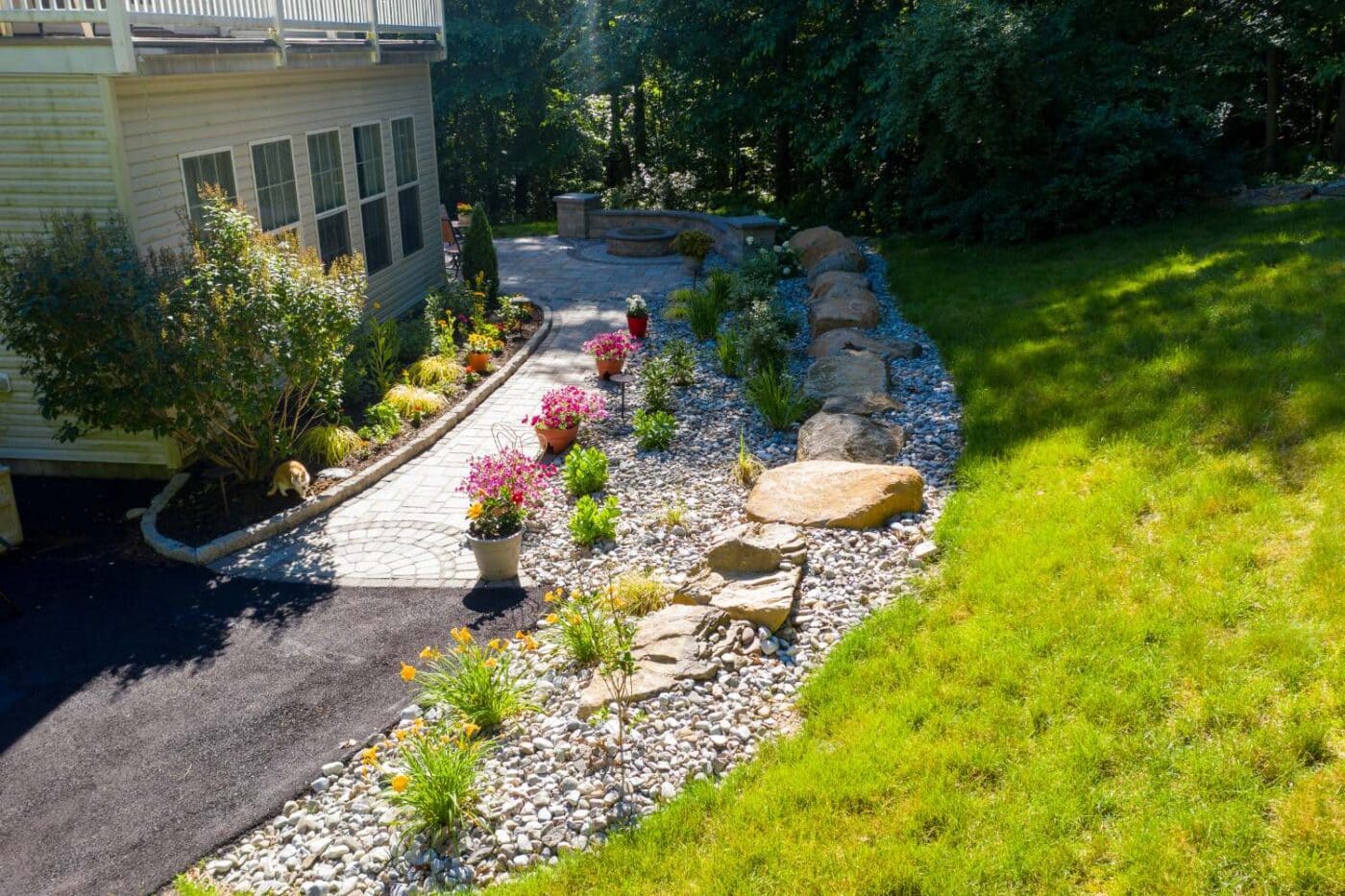 Patio and walkway with plants and flowers