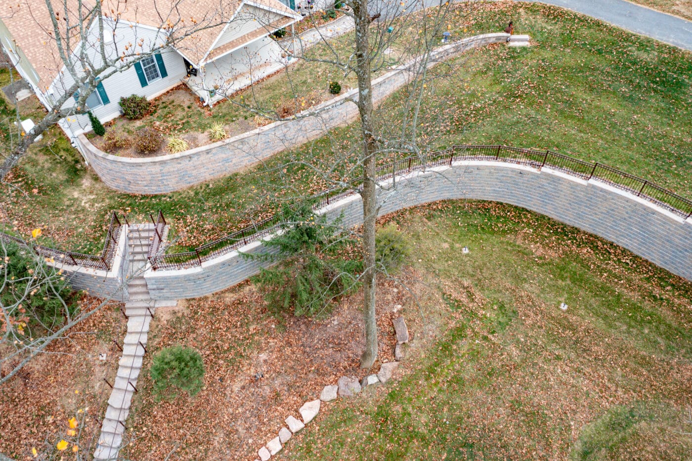 aerial view of a new retaining wall installation project by Willow Gates Home & Landscape