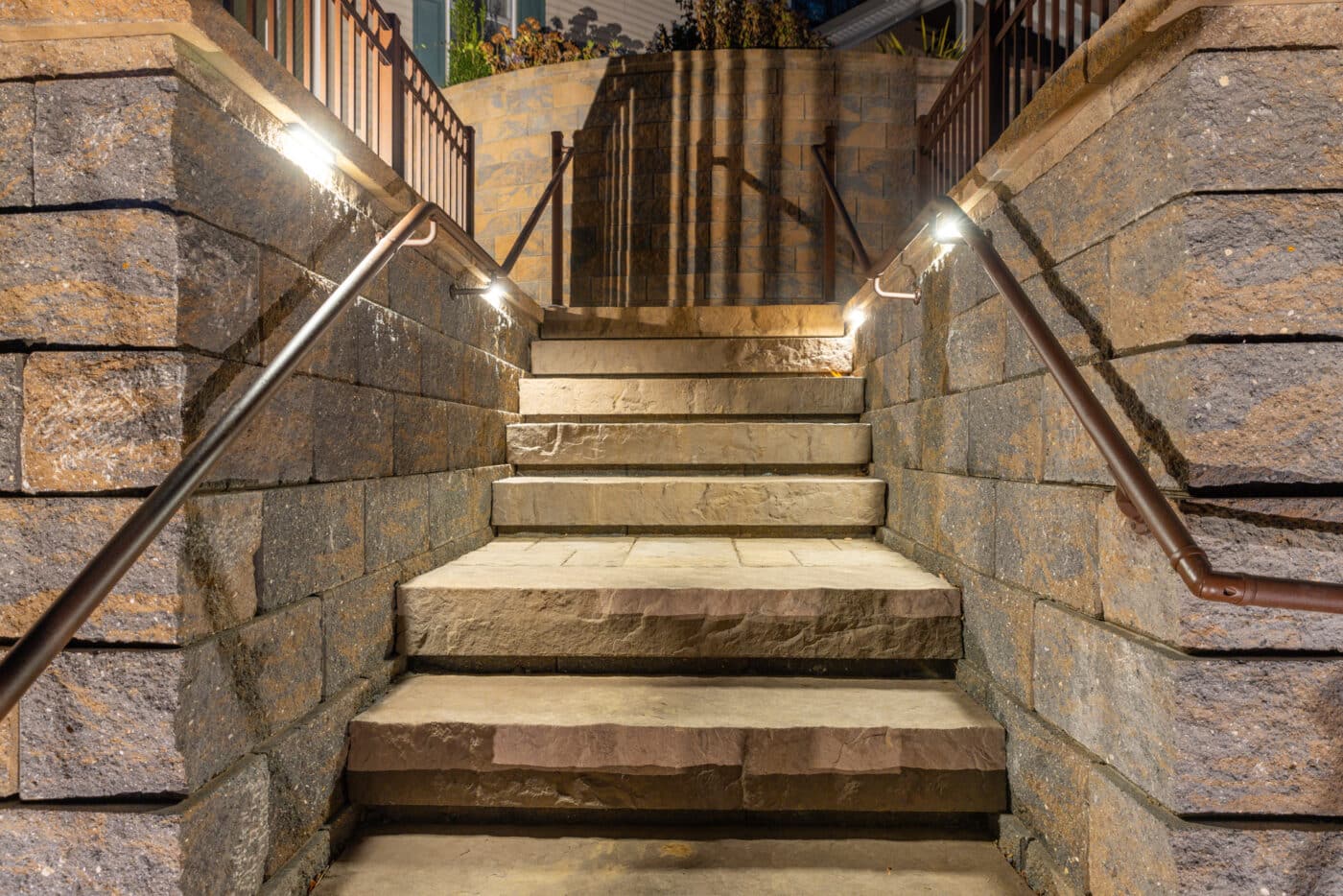 close up night time image of a stairway and lights installed by Willow Gates Home & Landscape in Berks County