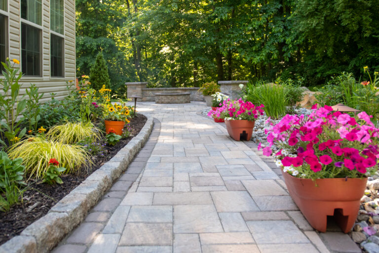 concrete walkway with flowers