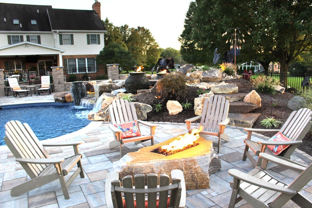 fire boulder and poolside patio with waterfall