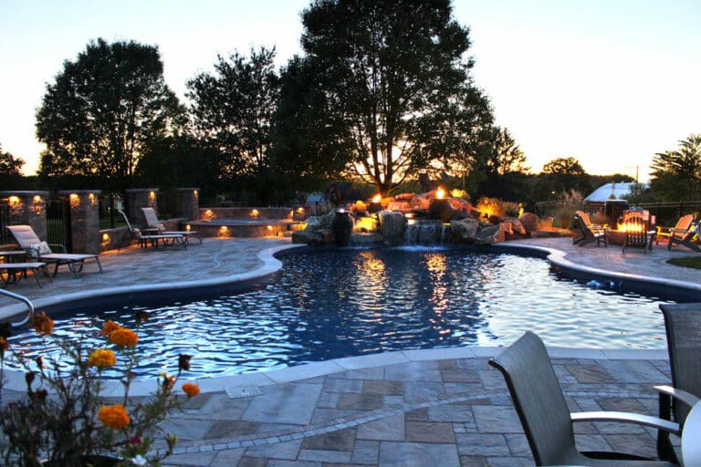 poolside patio with waterfall center view