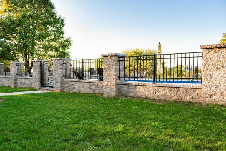 poolside patio with waterfall surrounding gate 1575043291