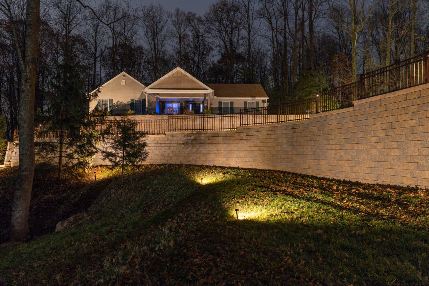 night image of the retaining wall and lighting system project by Willow Gates Home & Landscape in Berks County