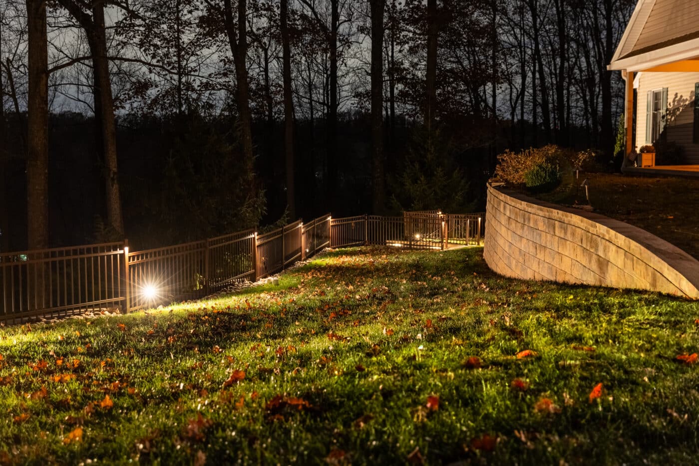 night time image of the lighting fixtures installed by Willow Gates Home & Landscape