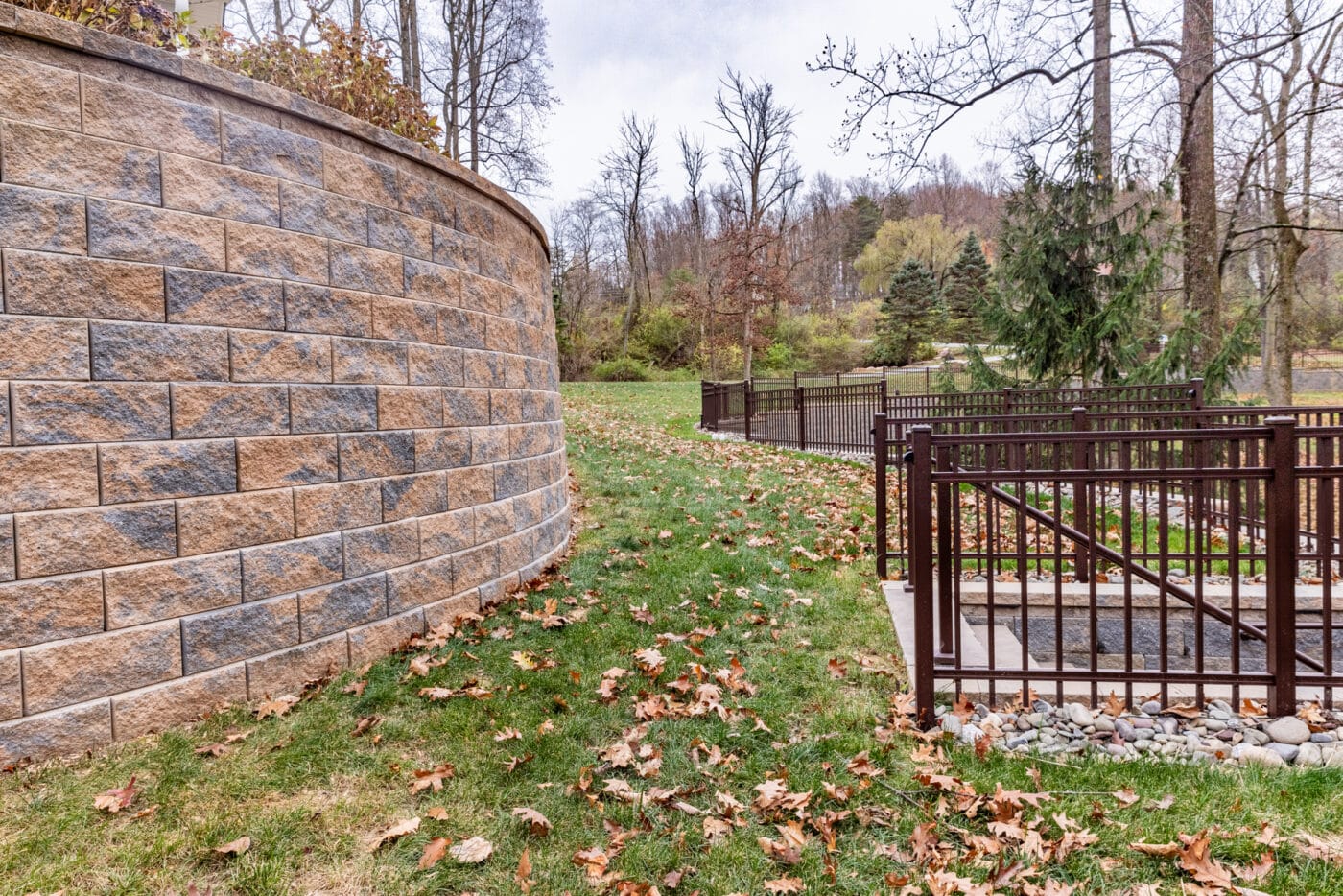 photo of a new retaining wall and staircase installed by Willow Gates Home & Landscape